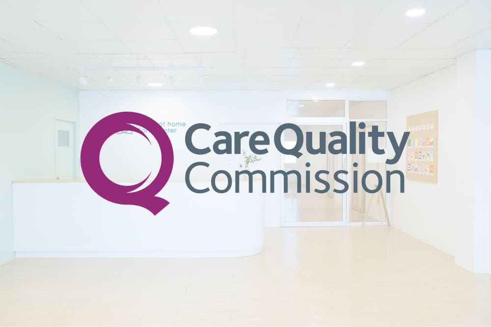 Logo of the Care Quality Commission, overlaid over a picture of the reception desk of a care home.